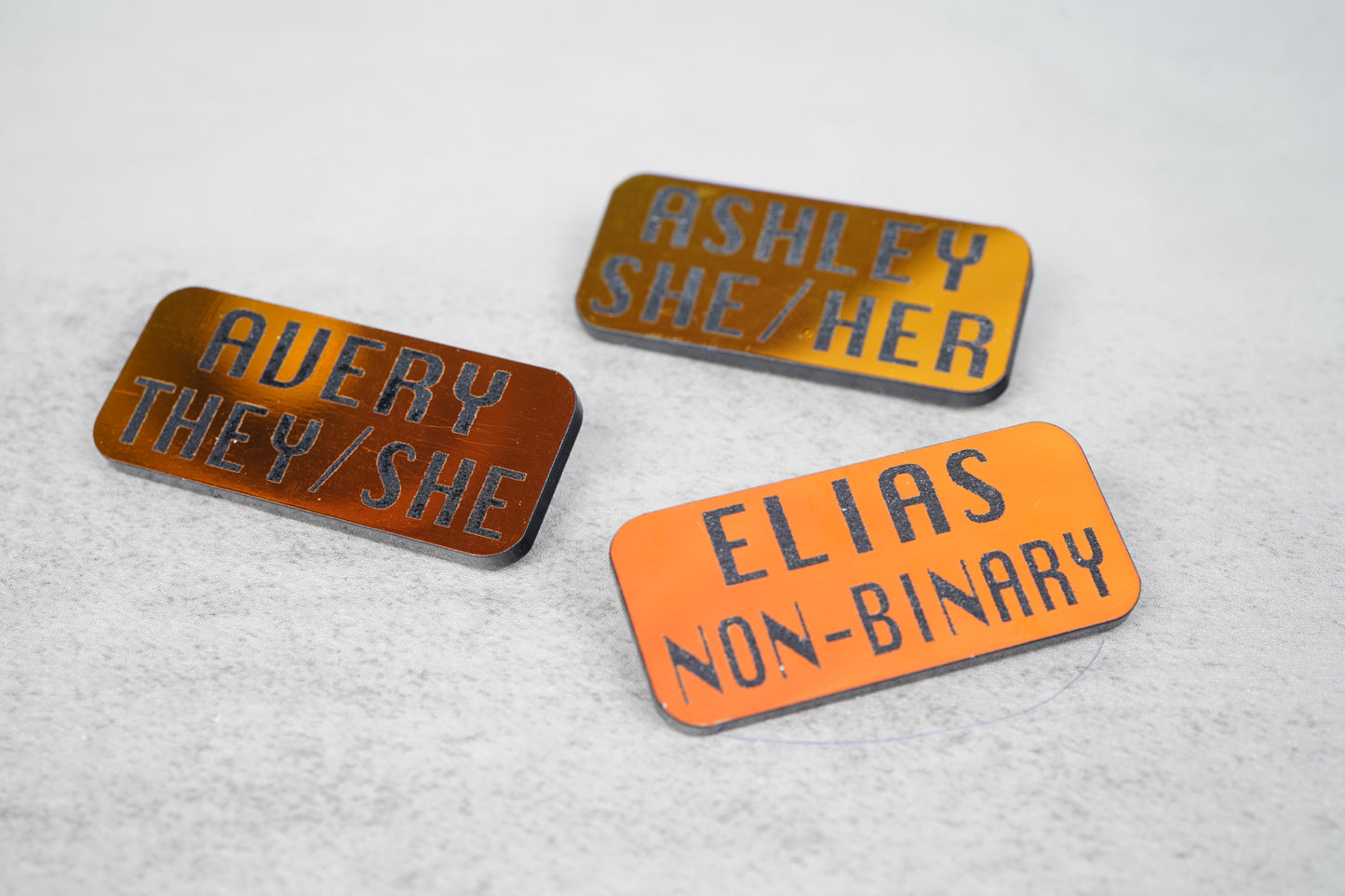 Custom name pronoun pins