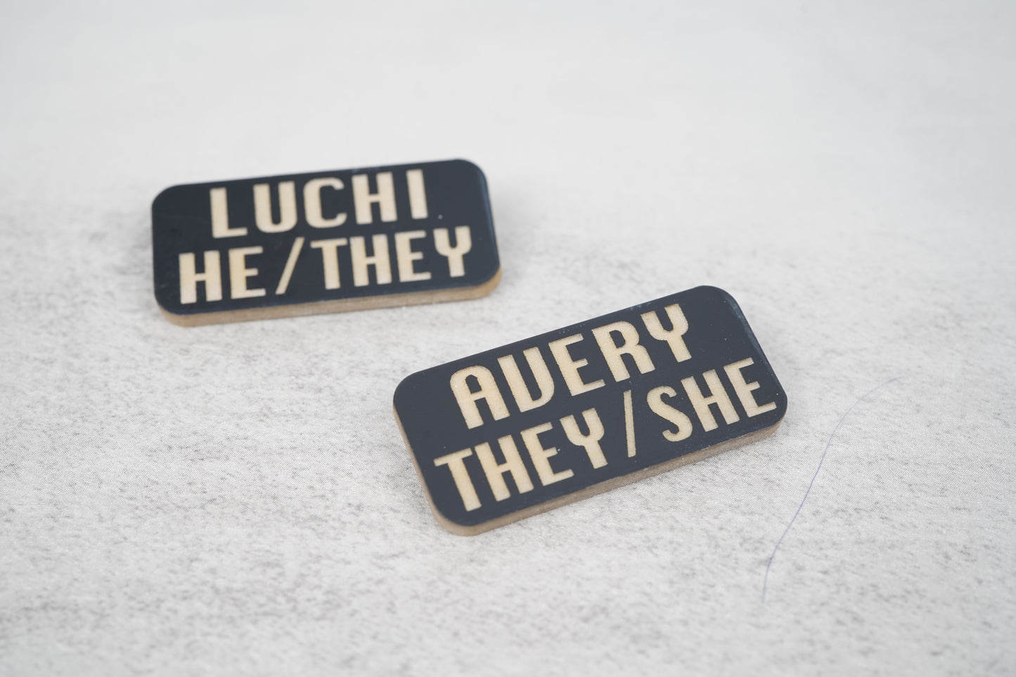 Custom name pronoun pins