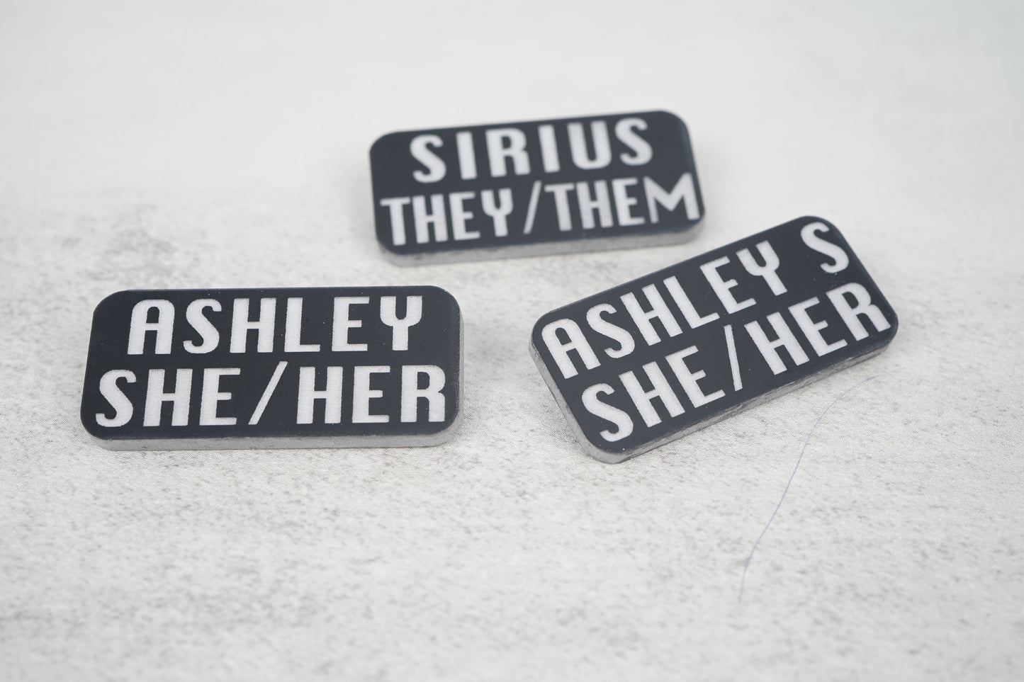 Custom name pronoun pins